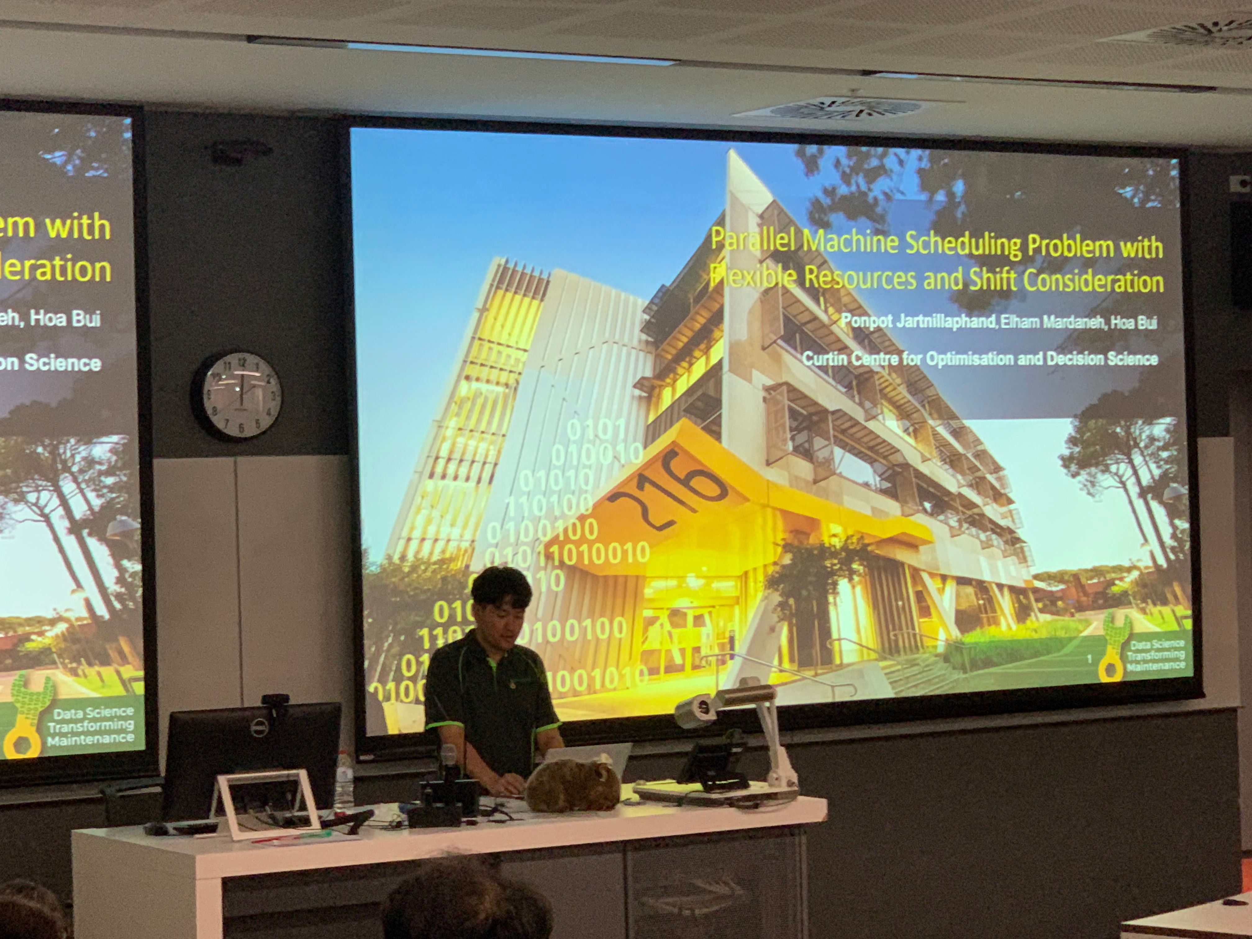 Ponpot presenting Parallel Machine Scheduling Problem with Flexible Resourced and Shift Consideration the WOMBAT conference.